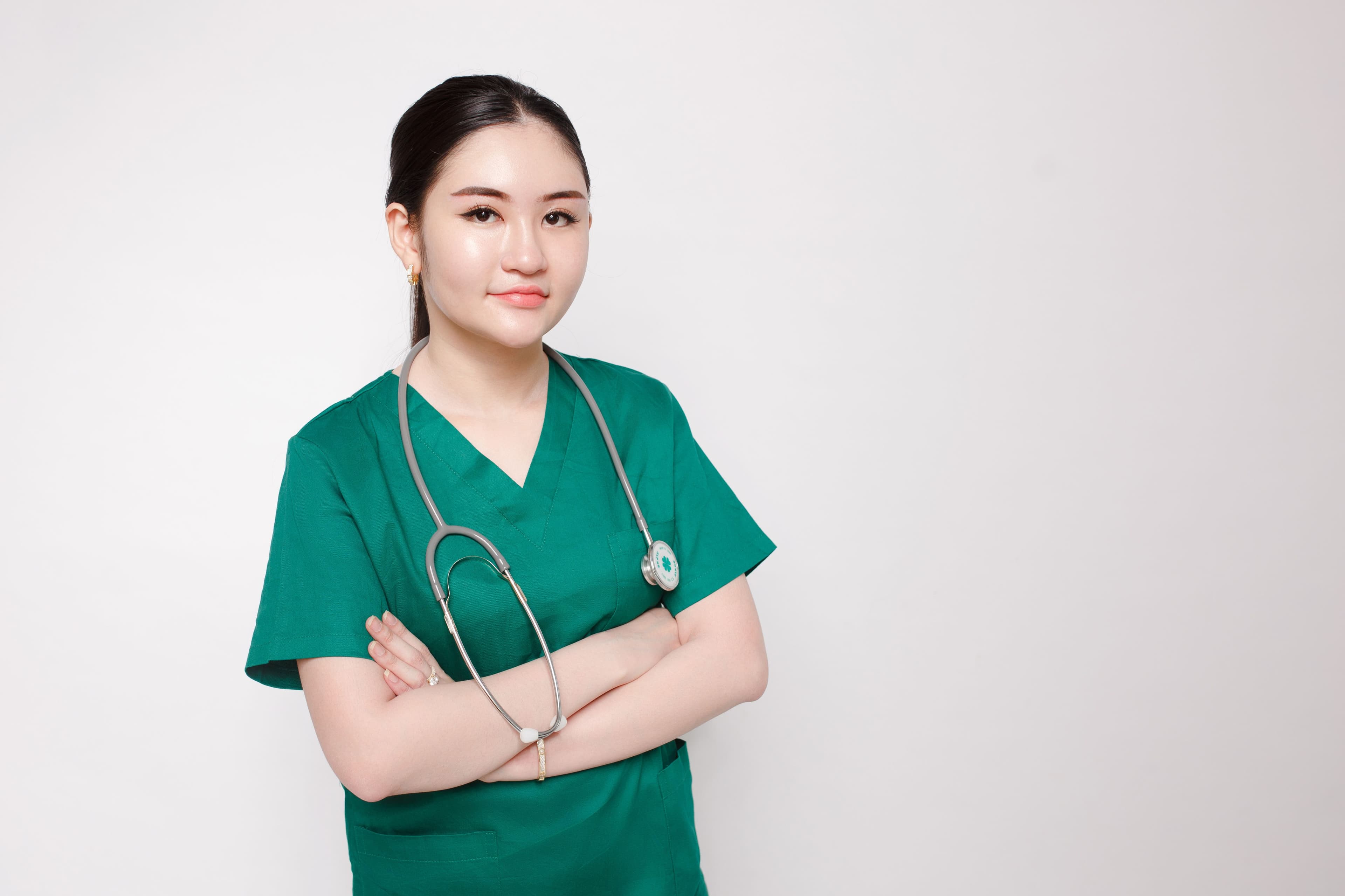 Doctor in green scrubs