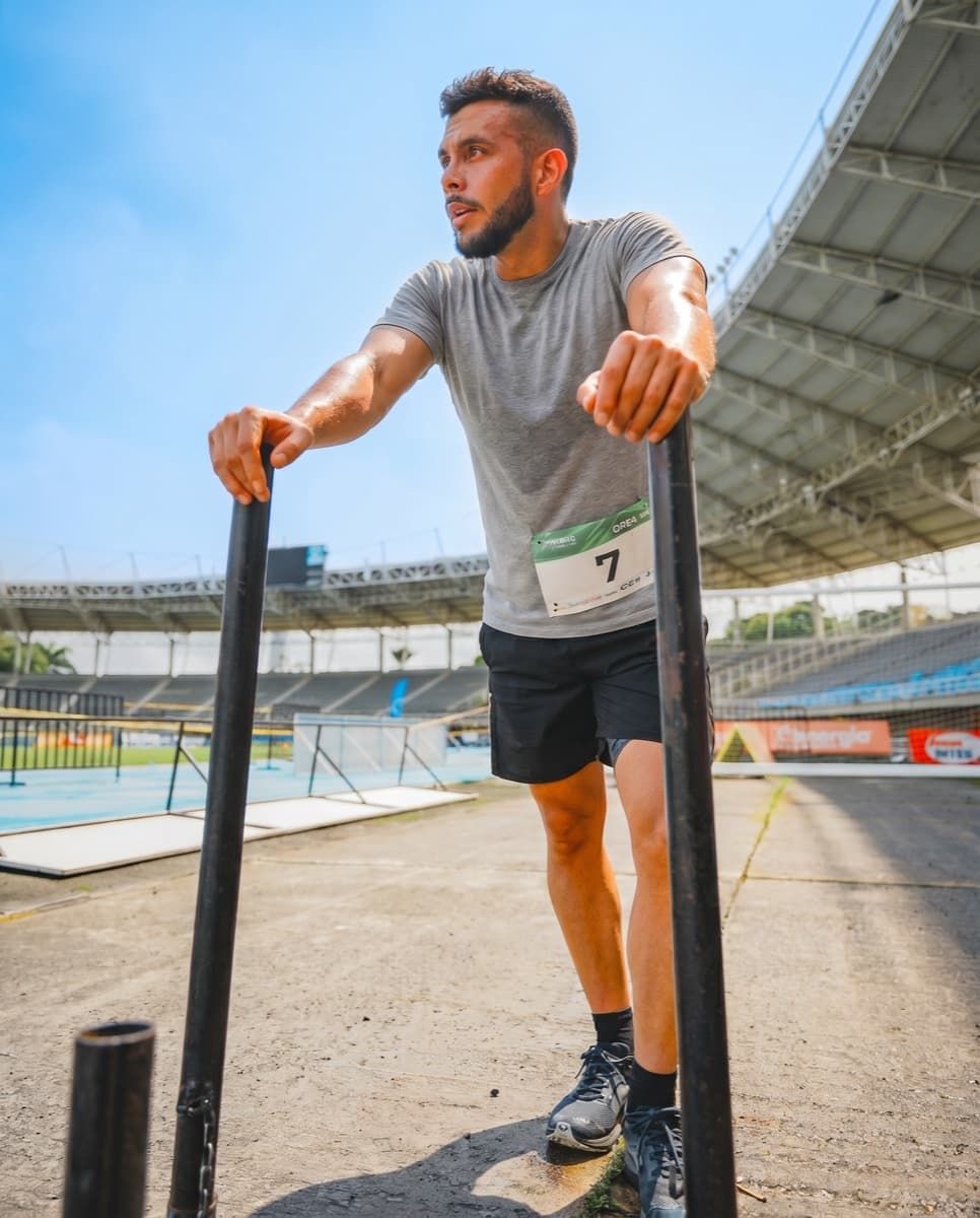 Man exercising on parallel bars outdoors